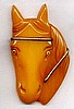 BP659 front facing butterscotch bakelite horse head pin
